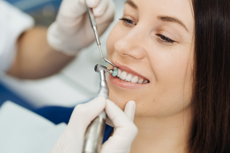 Patient smiling after getting Invisalign attachments taken off